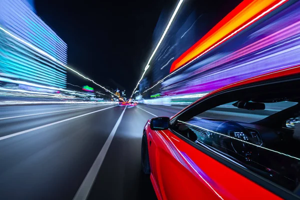 View from Side of Car moving in a night city