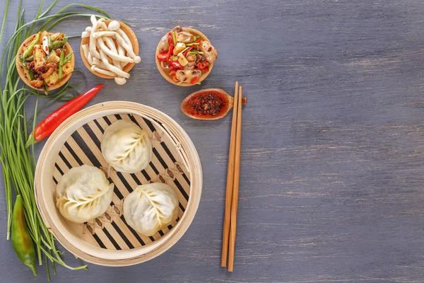 Traditional Chinese dishes - steam dumplings, hot salads, snacks Dam Sam. Top view. Copy space