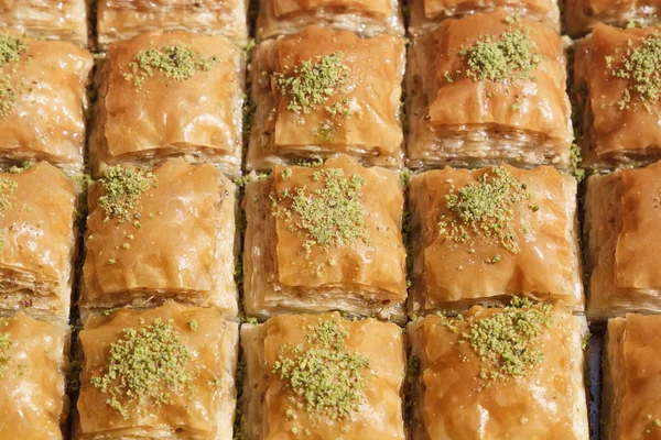 Traditional Turkish dessert baklava with nuts and honey. Close-up