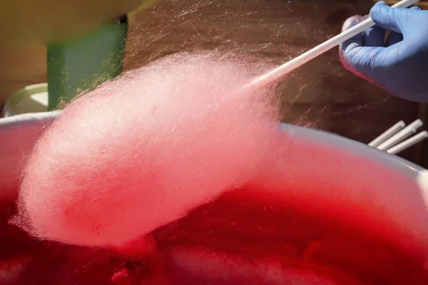 Cooking cotton candy on the street. Close-up