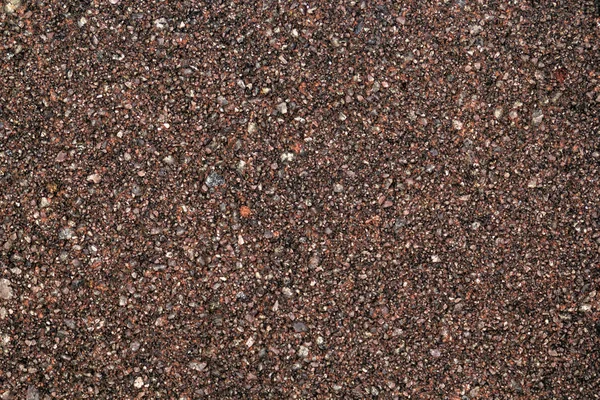Textura hrubého písku s červenými kamennými čipy — Stock fotografie