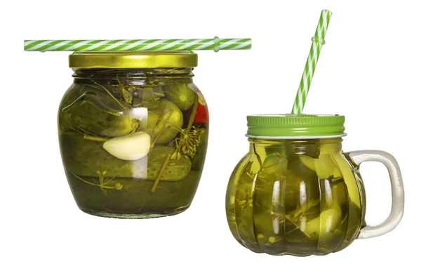 Dos frascos de vidrio con tapas y tubos con pepino en vinagre aislado sobre fondo blanco — Foto de Stock