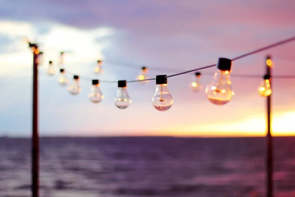 String Lights during sunset. Bulb background. Abstract background. Tallinn. Estonia.