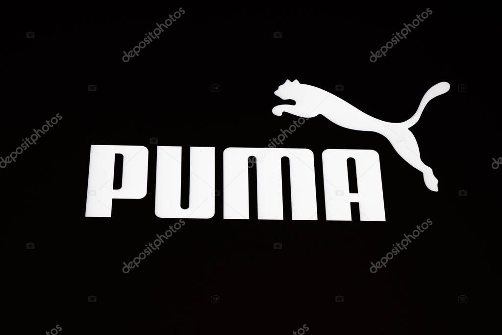 Close up of white Puma logo and leaping cat on a black facade. London, UK, 28 July 2024