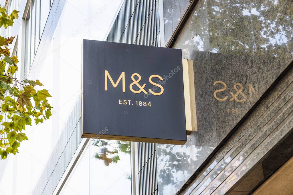 Marks and Spencer, M and S storefront sign on a sleek glass facade. London, UK, 5 October 2024