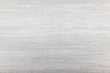 İnce dokuma dokusu olan ince açık gri kumaş arkaplan.