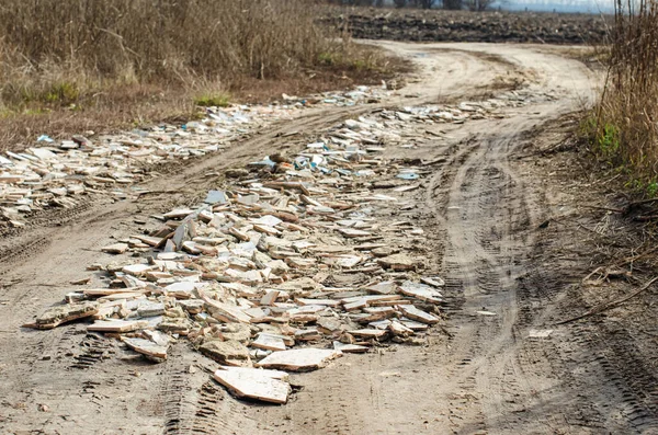 road covered with construction debris, leveling, road repair