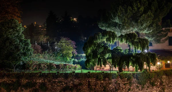 illuminated garden at night in the city of Bergamo