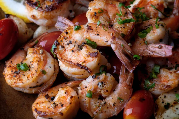 Grilled shrimps prawn with seasoning and herbs serve in plate with in door lighting.