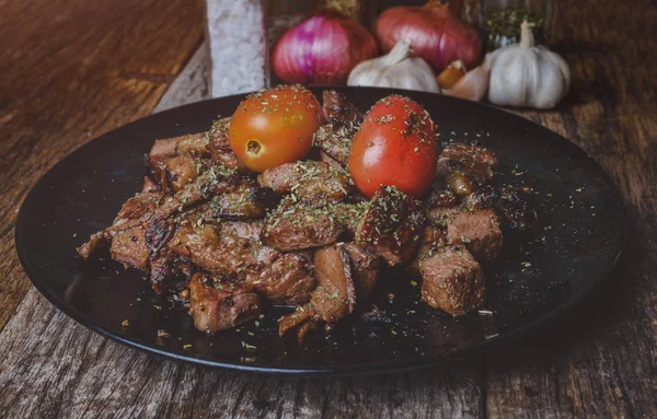 Cut beef steak grilled with spices seasoning.