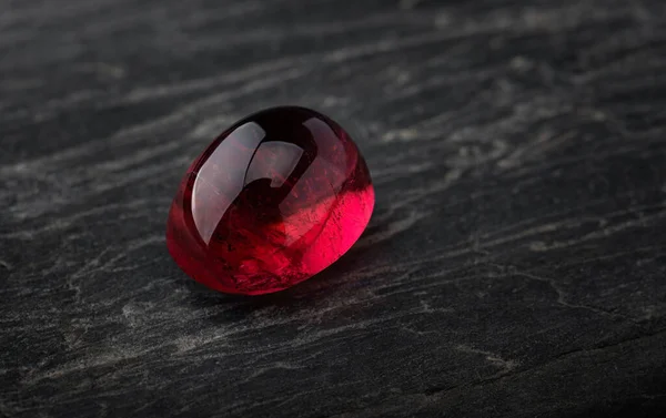 Red ruby gemstone  with dark blackground.