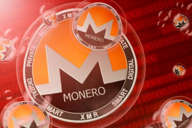 Monero çökmesi; Monero (XMR) ikili kod arka planında baloncuklar halinde bozuk paralar. Yakın plan.