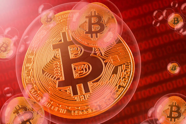 Bitcoin crash; bitcoin coins in a bubbles on the binary code background. Close-up