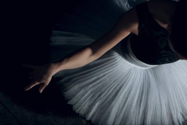 Ballerina on the stage. Woman ballet dancer, dressed in white tutu/