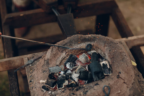 Blacksmith at work and tool