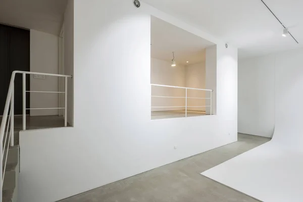 white studio with ceiling lighting in a white space