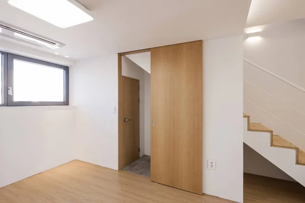 wood sliding door, window in a white interior