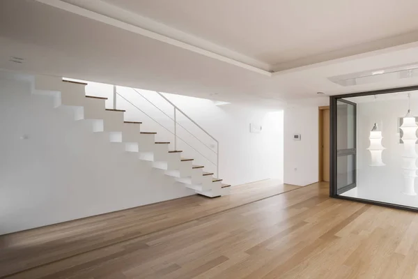 white empty living room with stair, wood floor.