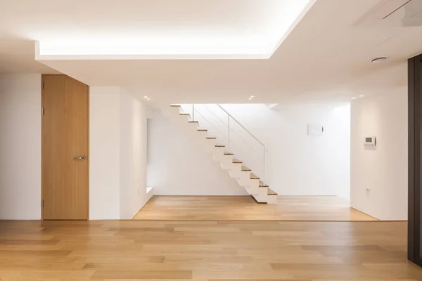 white empty living room with stair, wood floor.