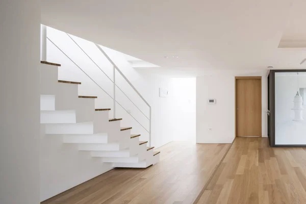 white empty living room with stair, wood floor.