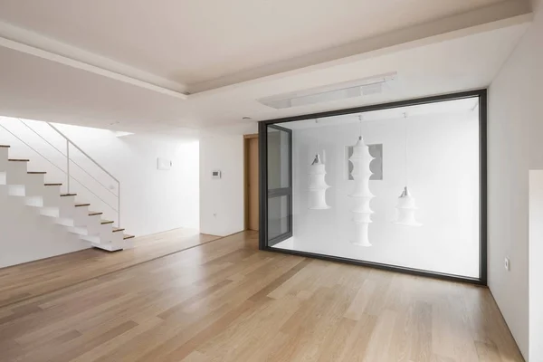 white empty living room with stair, wood floor.