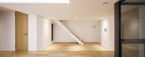 white empty living room with stair, wood floor.