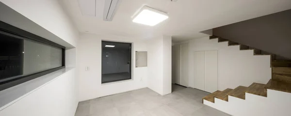 white room with window at the night.