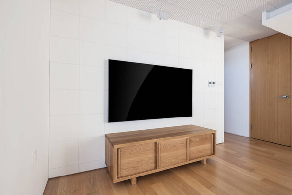 tv with wood shelf in a white interior