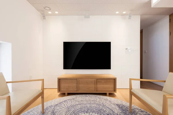 television with furniture in a white interior