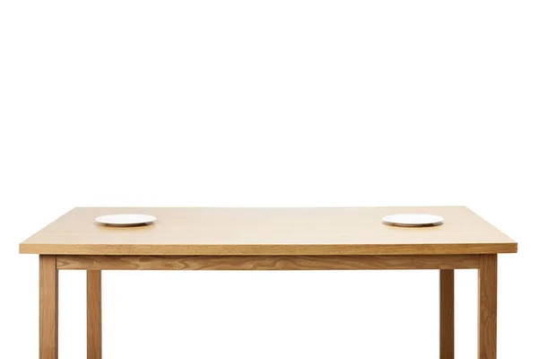 木制桌子上的两个白色的空盘子 背景是白色的 — 图库照片
