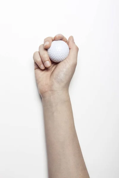 Frauenhand Hält Einen Weißen Ball Auf Weißem Hintergrund — Stockfoto