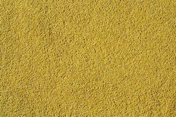Fondo de mijo amarillo. Textura y detalles de mijo pulido — Foto de Stock
