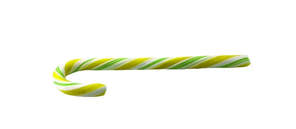 白い背景に分離された黄色の弓とクリスマスのお菓子の杖. — ストック写真