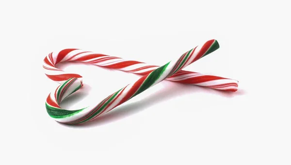 Різдвяна цукеркова тростина з червоним і зеленим бантом . — стокове фото