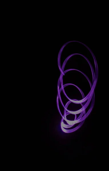 Freeze light photo, abstract lilac color on black background, made with light painting or light drawing — Stock Photo, Image