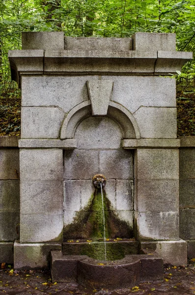 source of healing water in a beautiful old stone decoration