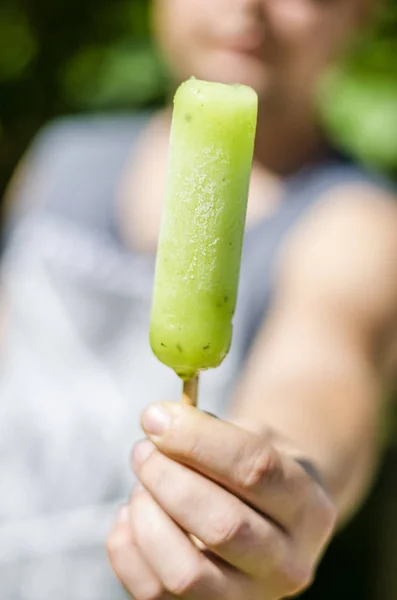 frozen juice in a guy\'s hand