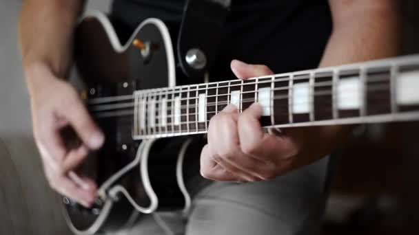 Mans hands playing the funky rhythm on electric guitar, electric musical instruments, playing loud on the guitar, rock guitars
