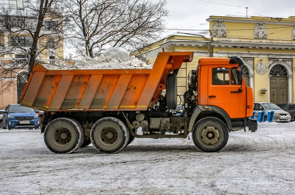 Snow removal on the town square in Saint-Petersburg.