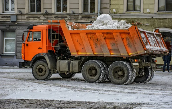 Snow removal on the town square in Saint-Petersburg.