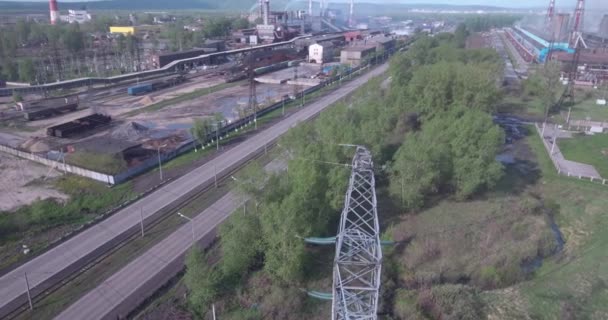 Aerial view. High voltage tower and industrial plants. Air pollution from industrial plants. 4K — Stock Video