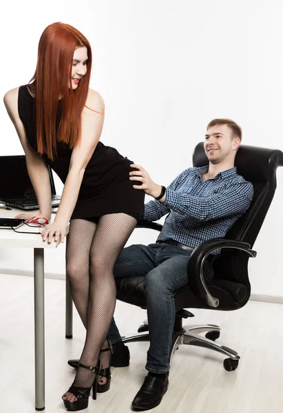 Sexy secretary flirting with boss in the workplace. sexual harassment and office abuse concept — Stock Photo, Image