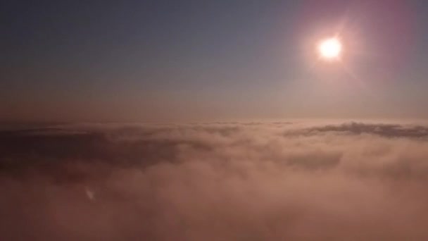 Aerial view of sunrise over fog. Fog in valley view from above. Autumn morning in mountain valley. — Stock Video
