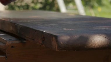 Carpenter Restoring Old Furniture Cleaning From Old Paint With