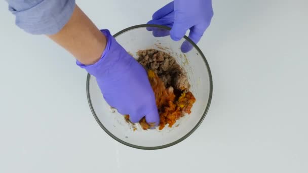 Confectioner mixes the ingredients for candy in a glass bowl. hand made sweets. top view 4K — Stock Video