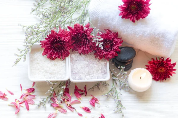 Thai Spa Treatments aroma therapy salt and sugar scrub and rock massage with red flower with candle for relax time. Thailand. Healthy Concept. copy space