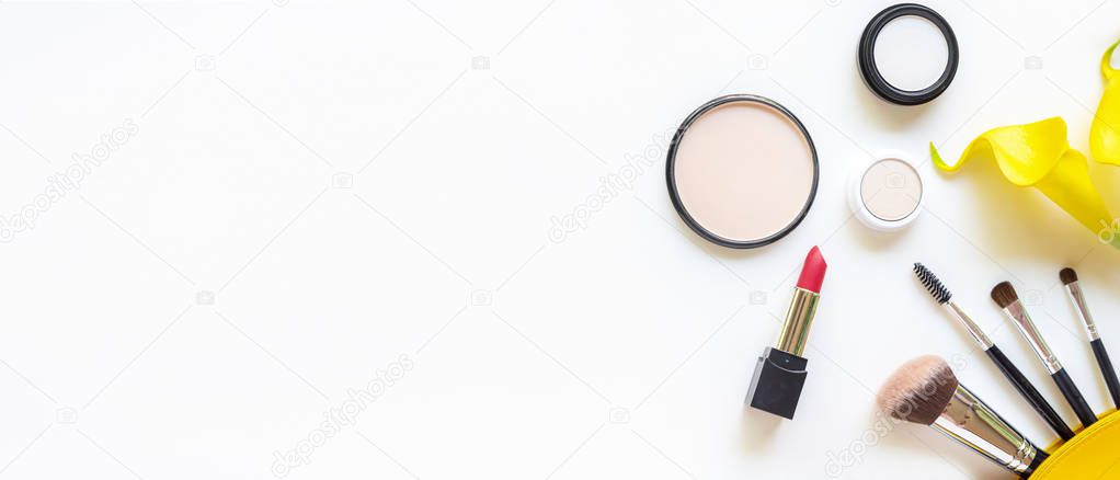Makeup cosmetics tools and beauty cosmetics gift, products and facial cosmetics package lipstick with yellow lily flower on the white background, top view and copy space and text for banner.  Lifestyle Beauty Concept