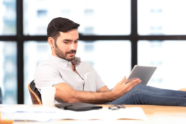 Relax time.  Successful Businessman relaxing  and resting after sitting and hard working in modern office. Healthy care for time. Business Concept