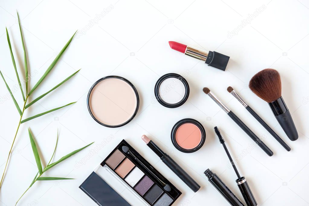 Makeup cosmetics tools background and beauty cosmetics, products and facial cosmetics package lipstick, eye shadow on the white background. Lifestyle Fashion Concept