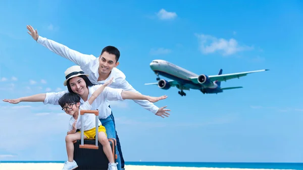 Asian happy family have fun on the beach watching the landing planes. Traveling on an airplane for leisure and destination.  Family tourism travel in summer and holiday.  Copy space for banner in text.  Travel and Family Concept